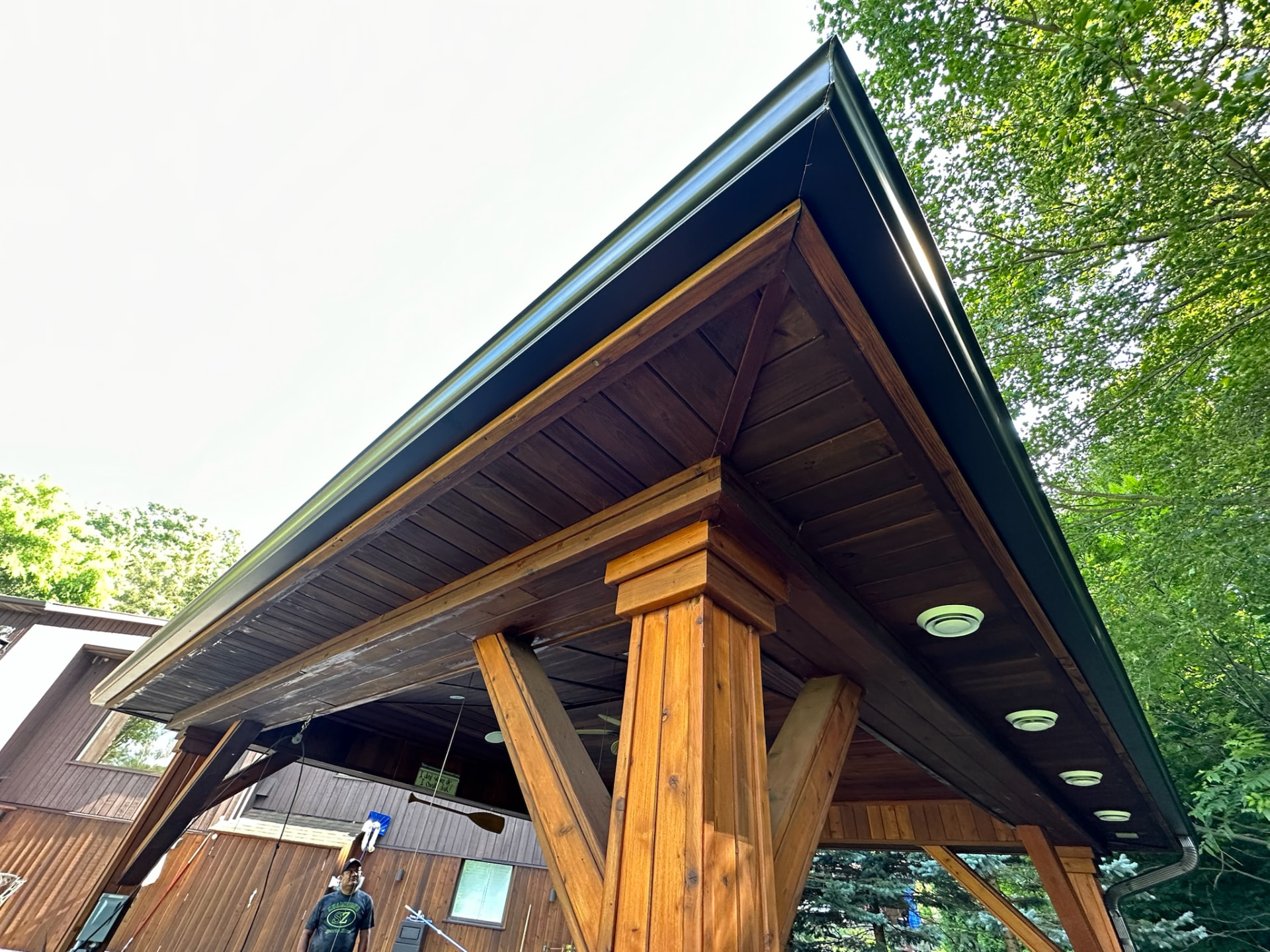 Covered structure with fascia and eavestrough
